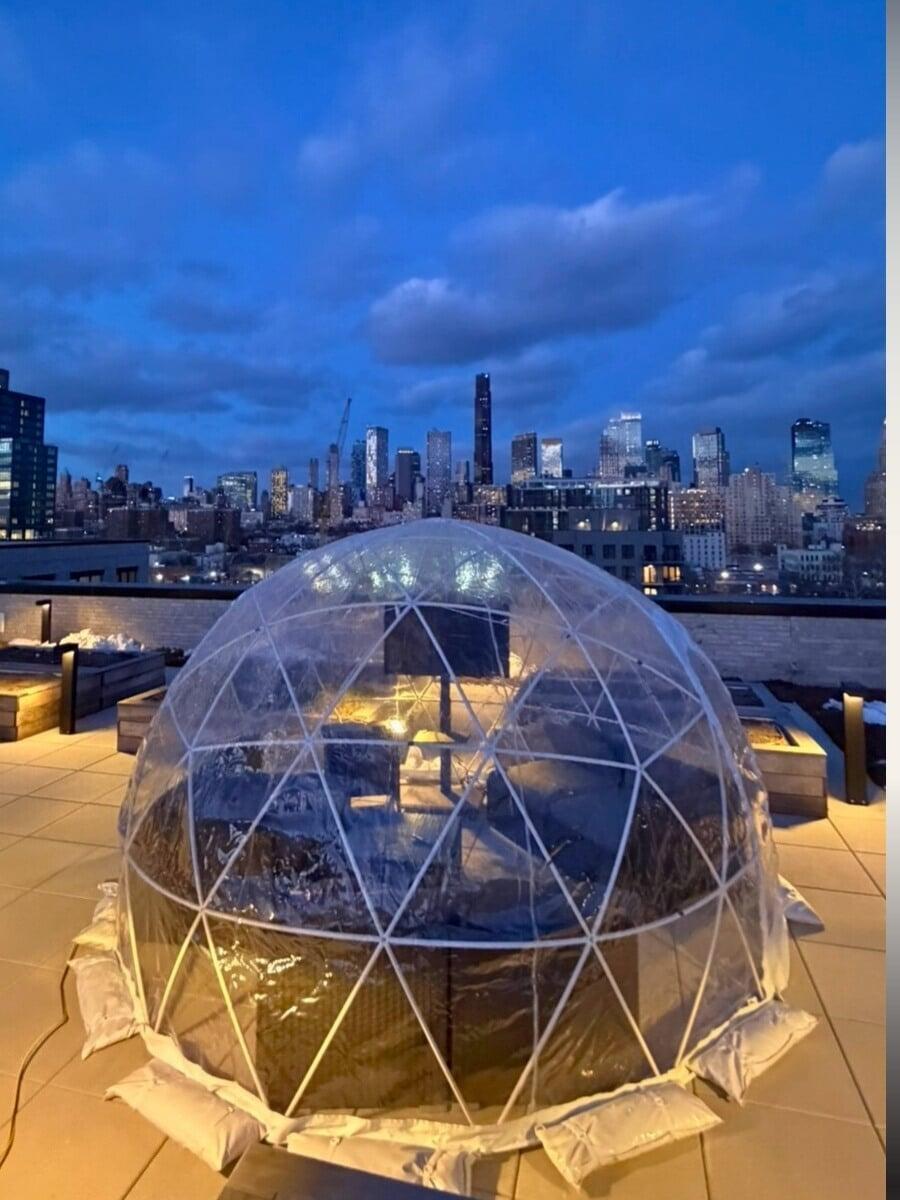 Outdoor igloo dining setup at a hotel patio in New York